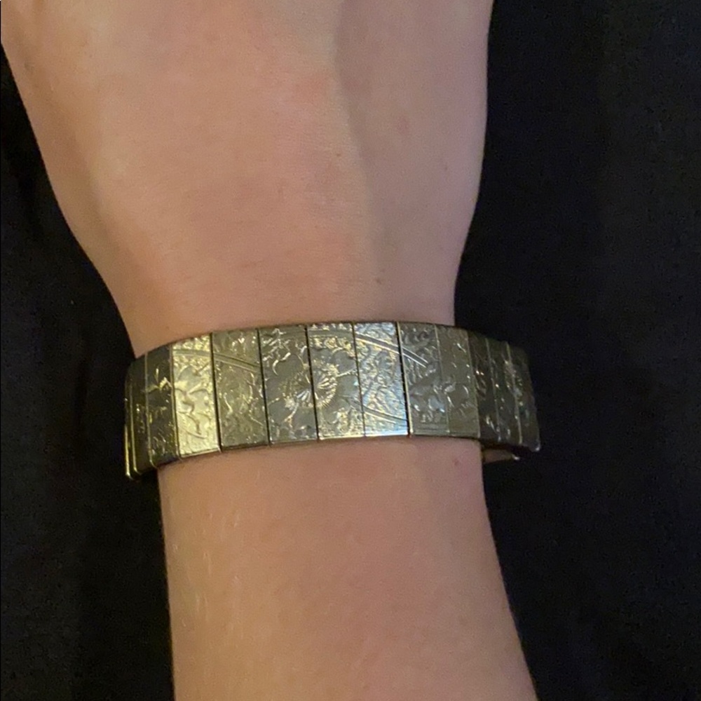 Antique silver flower clasp on bracelet